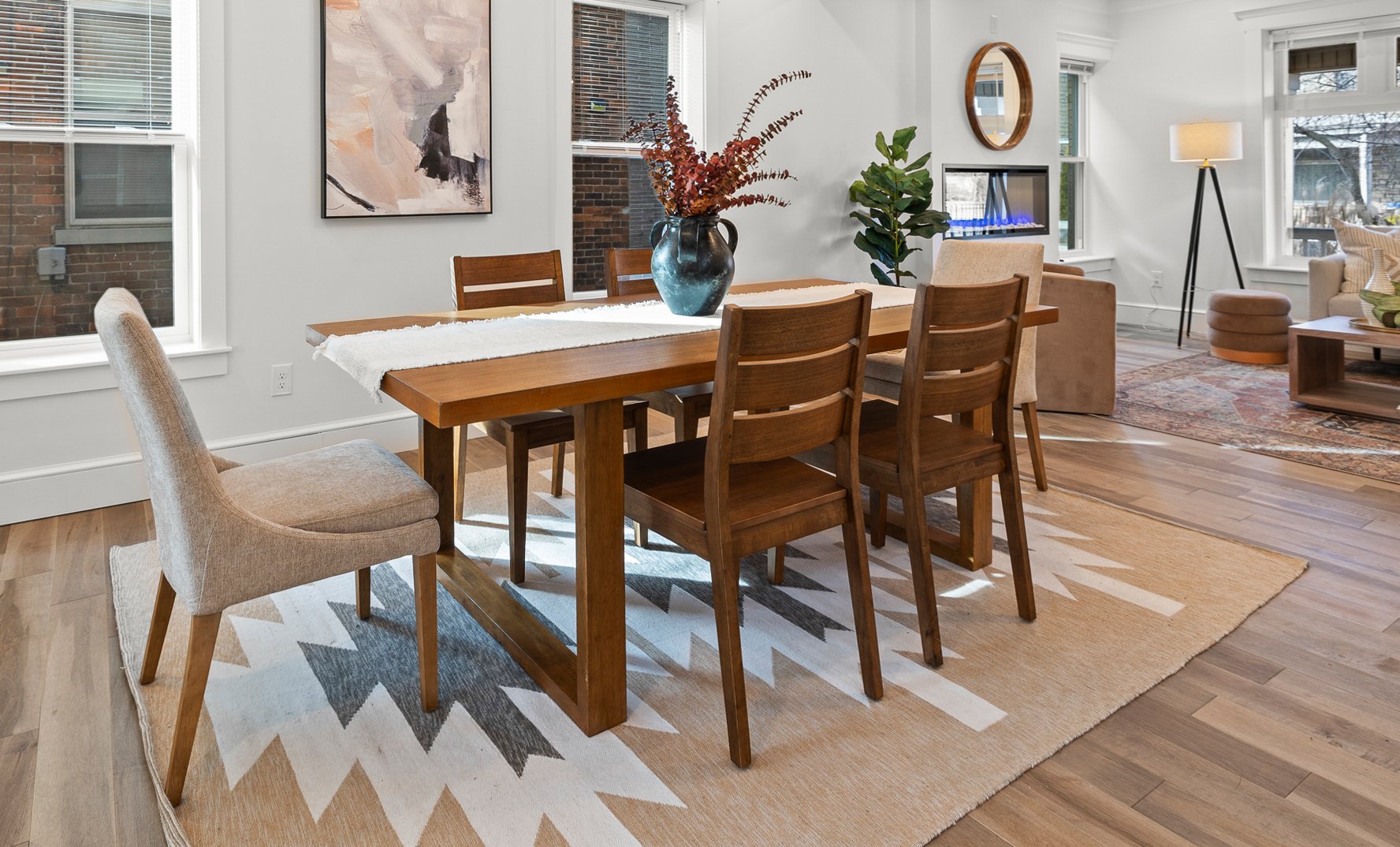 Dining room staging with designer furniture in a remodeled historic home.
