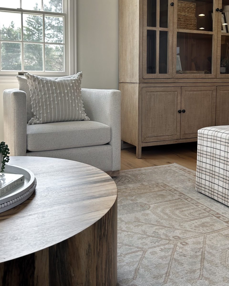 Living room occasional chairs with large bookshelf/display cabinet