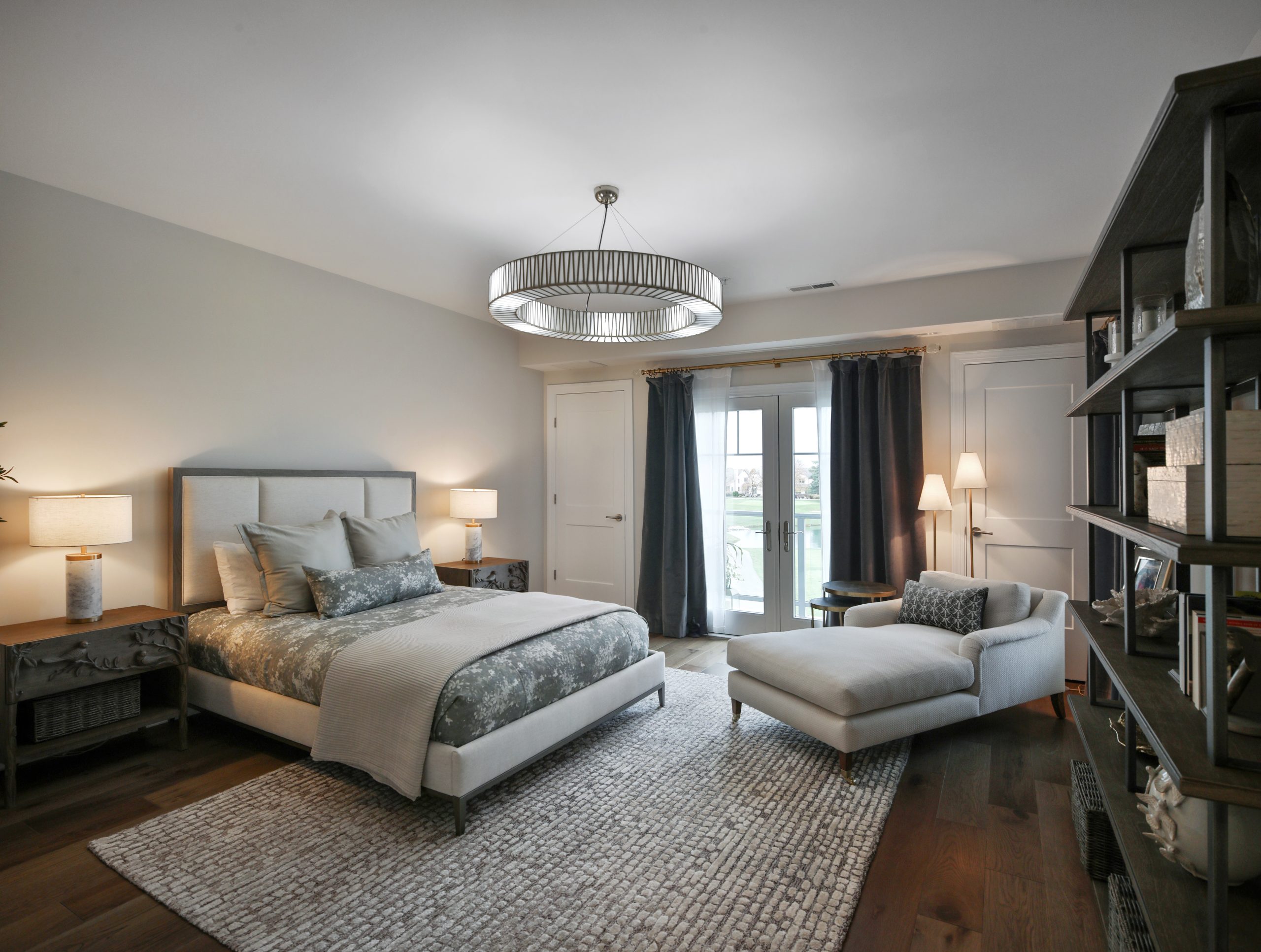 Primary bedroom in condo overlooking a country club gold course.