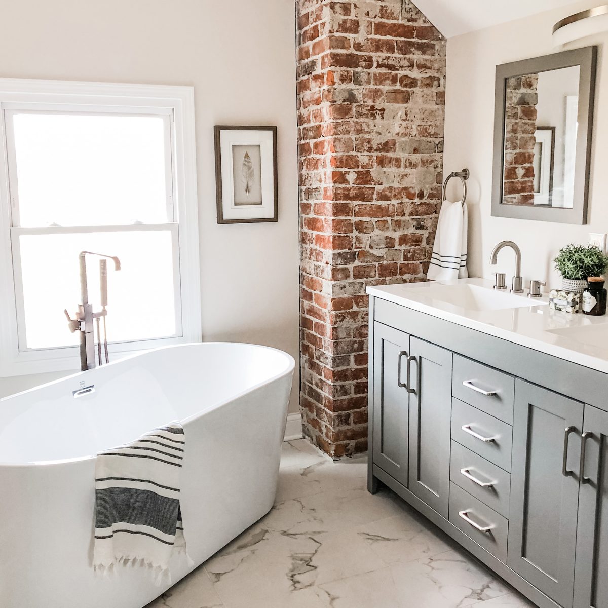 A fully remodeled bathroom with double vanity and large bathroom professionally staged in Pacific Palisades, California.