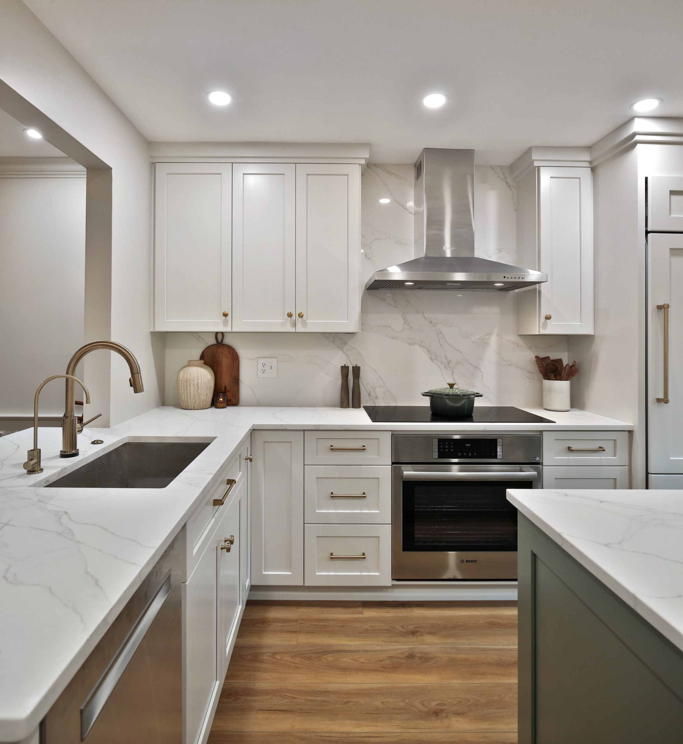 White cabinetry and granite countertops with luxury appliances completed this central Ohio interior design construction project.