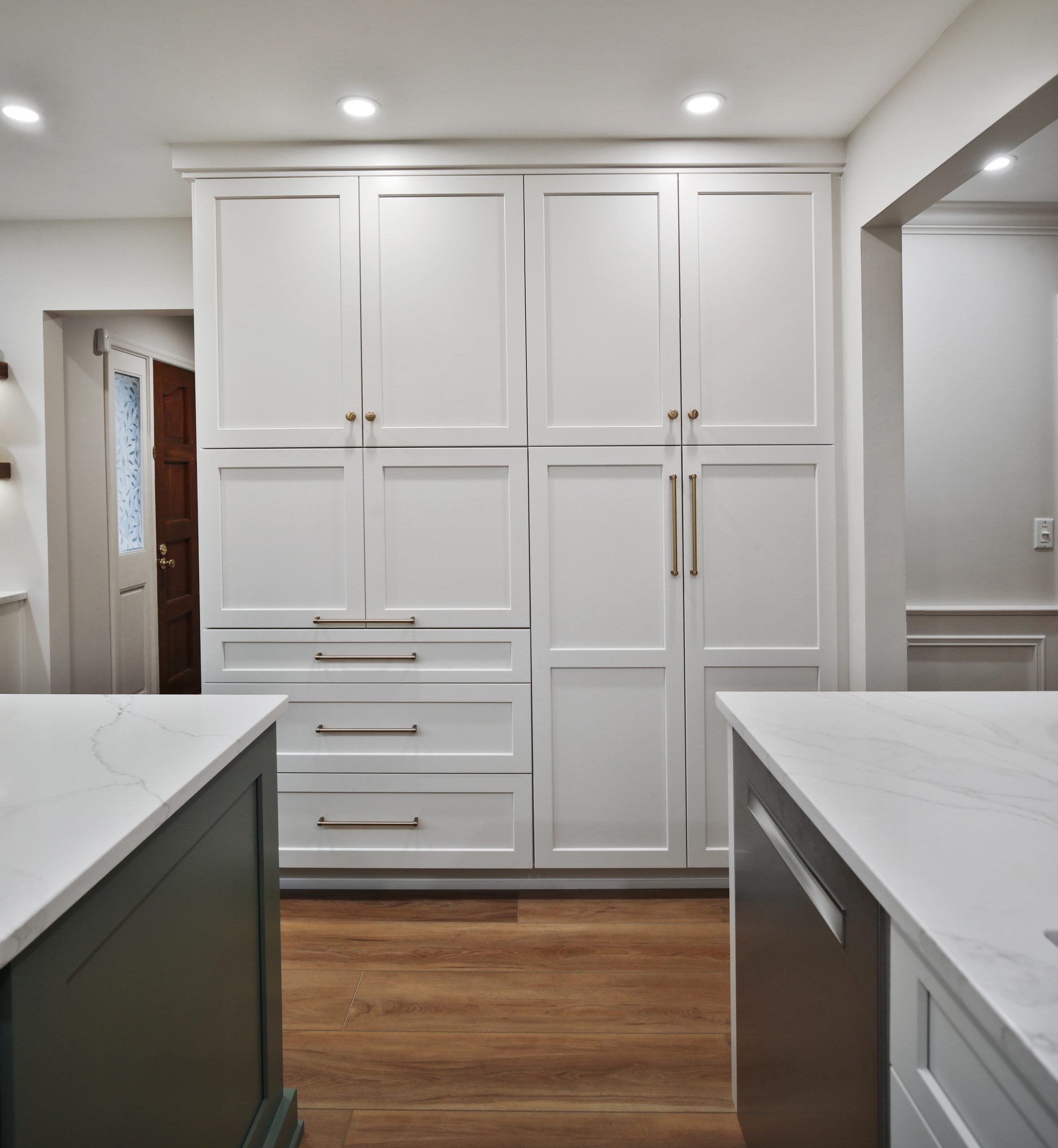 Floor to ceiling custom white cabinets in a remodeled Clintonville home.