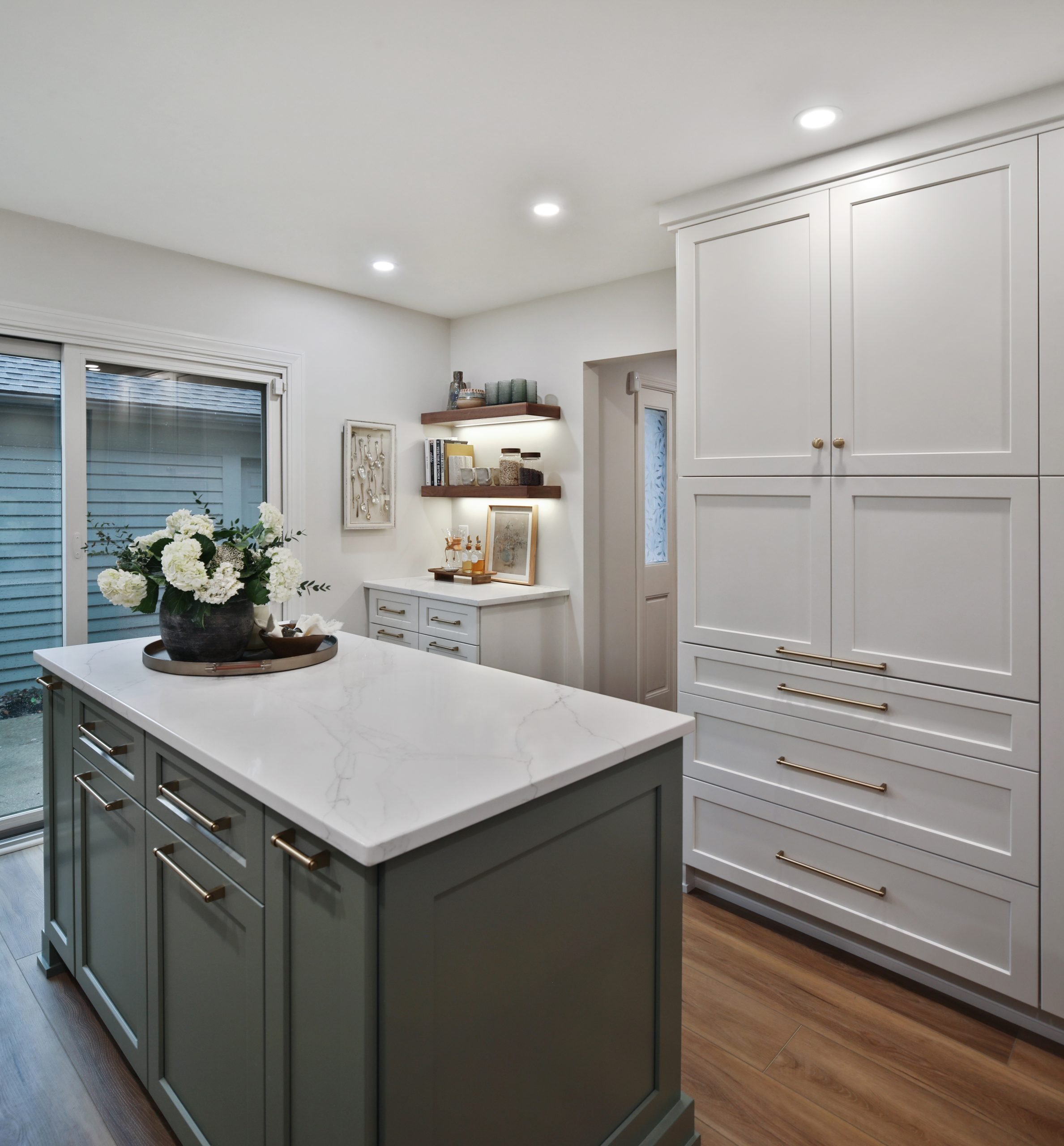 Floor to ceiling custom white cabinets in a remodeled Clintonville home.