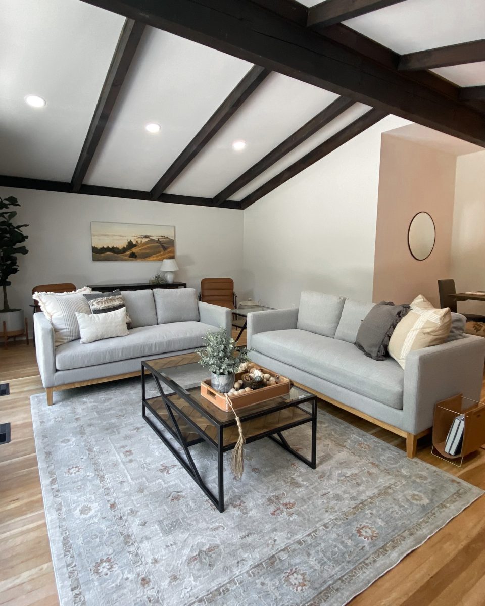Living room interior design with grey theme, natural textures and modern coffee table.
