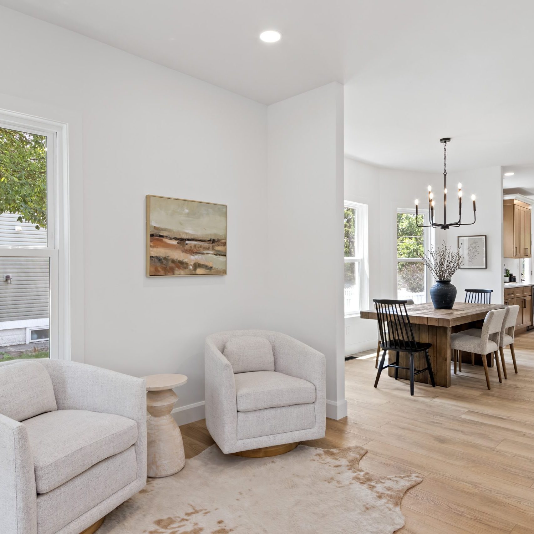 Modern swivel chairs in a seating area adjacent o the living room in a beautifully remodeled Westerville home.