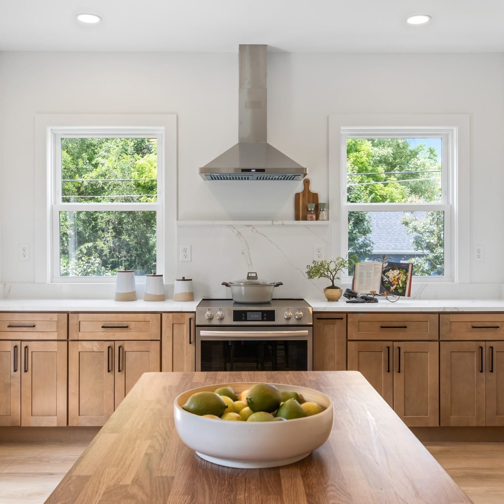 Fully remodeled kitchen with light wood cabinets and white countertops in Westerville, Ohio.