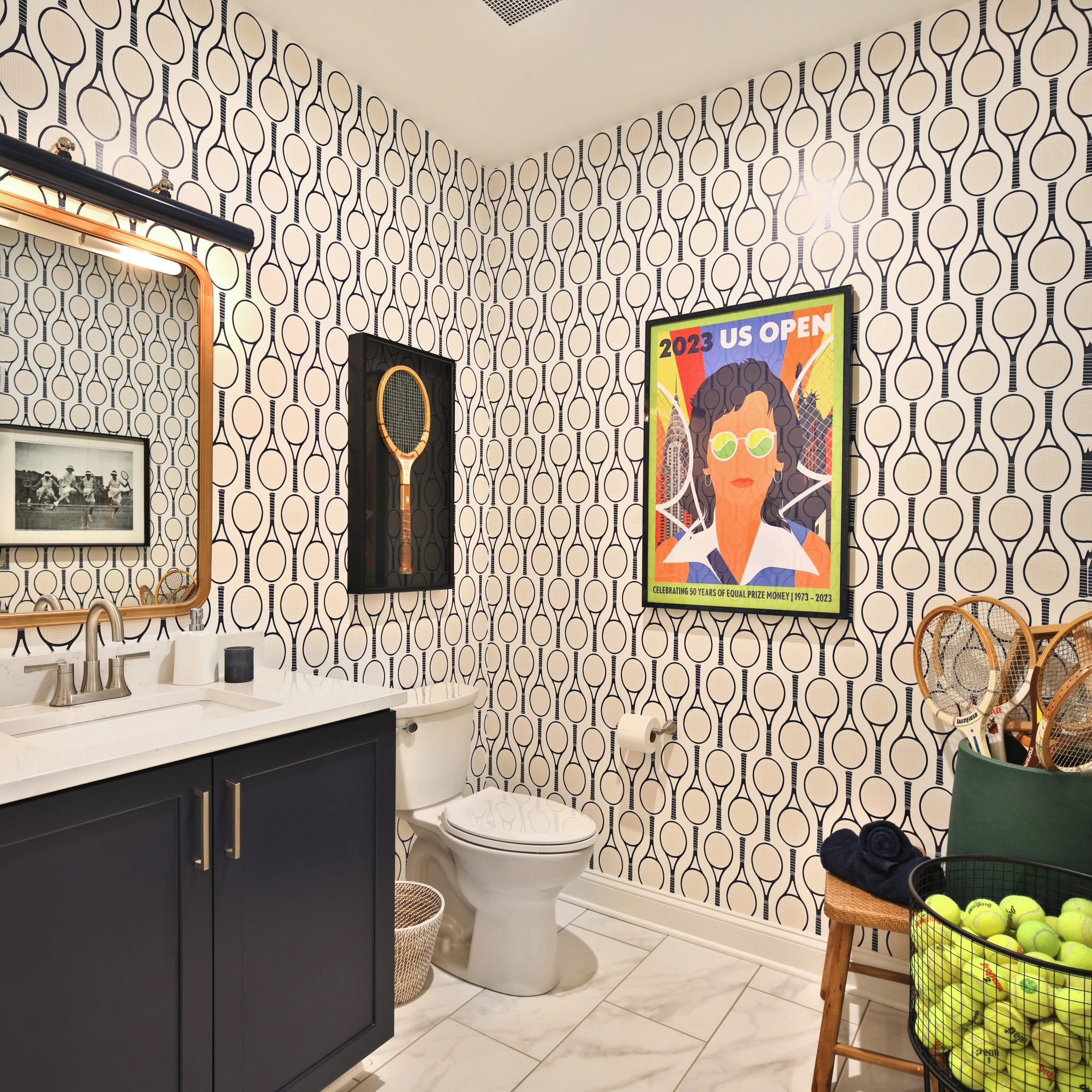 Custom designed bathroom in Westerville, Ohio condo with U.S. Open tennis theme wallpaper and decor.