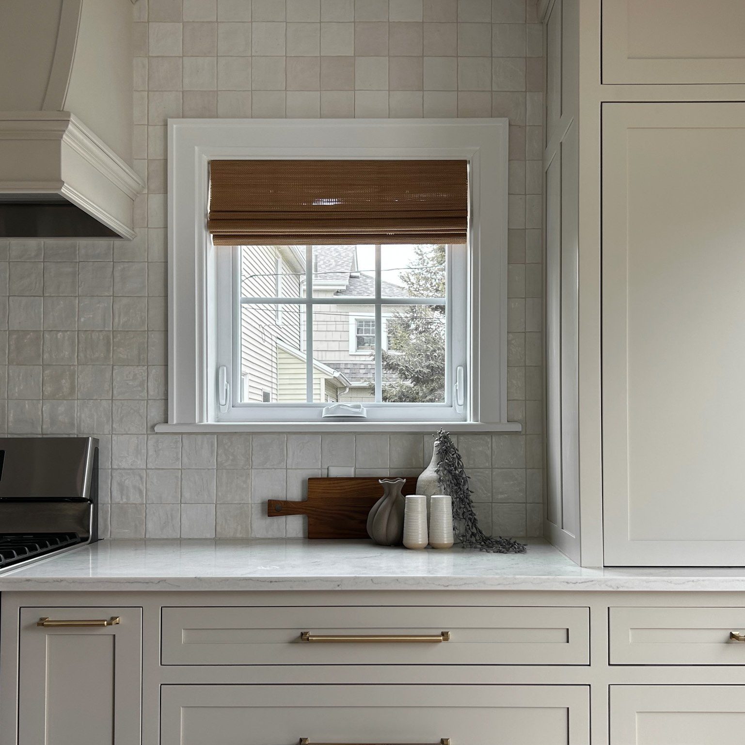 Complete remodeling of Clintonville, Ohio home in central Ohio with custom cabinetry and white tile backsplash and white counter tops.