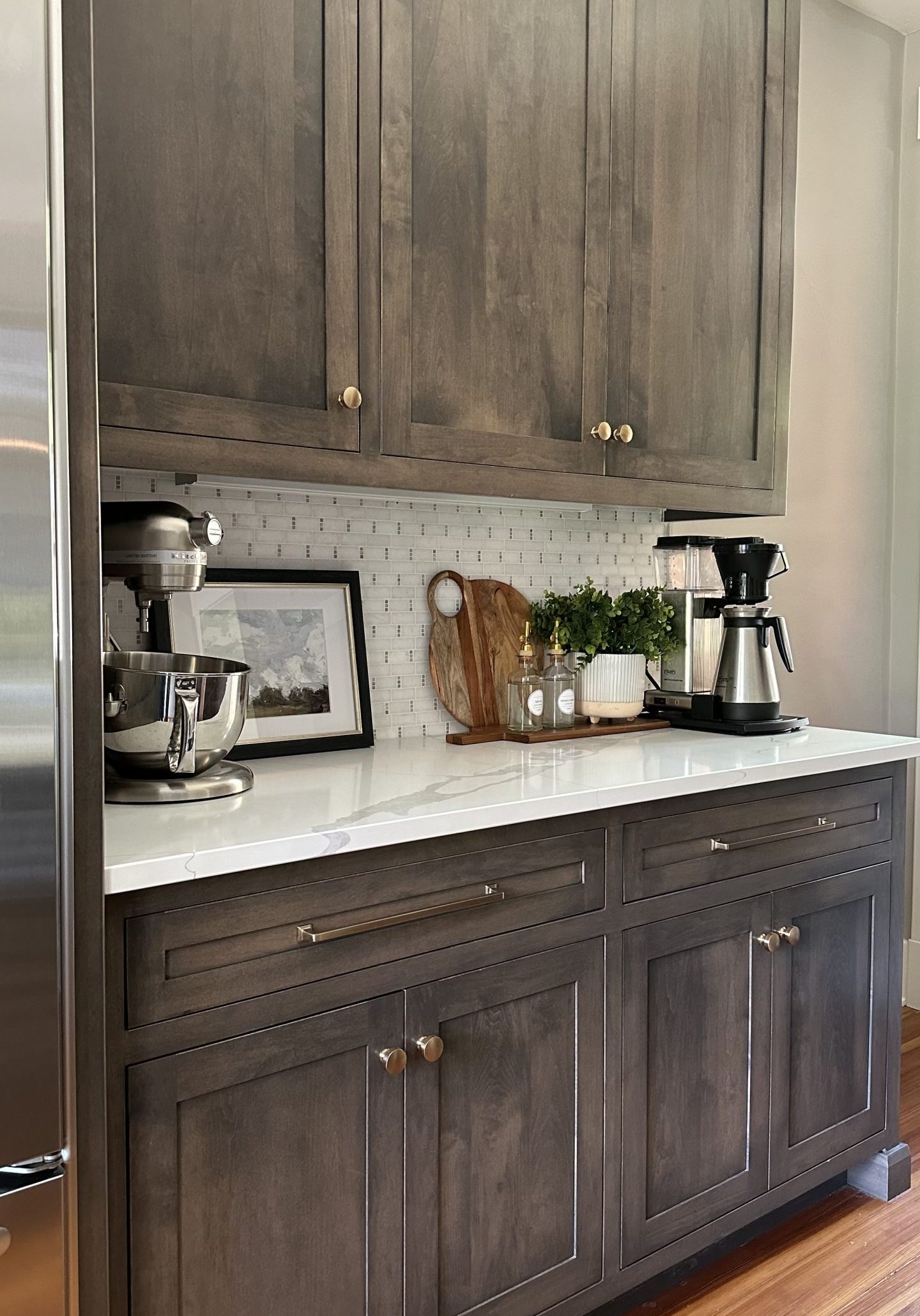 White granite countertops in a German Village home with modern coffee maker and kitchen decor.