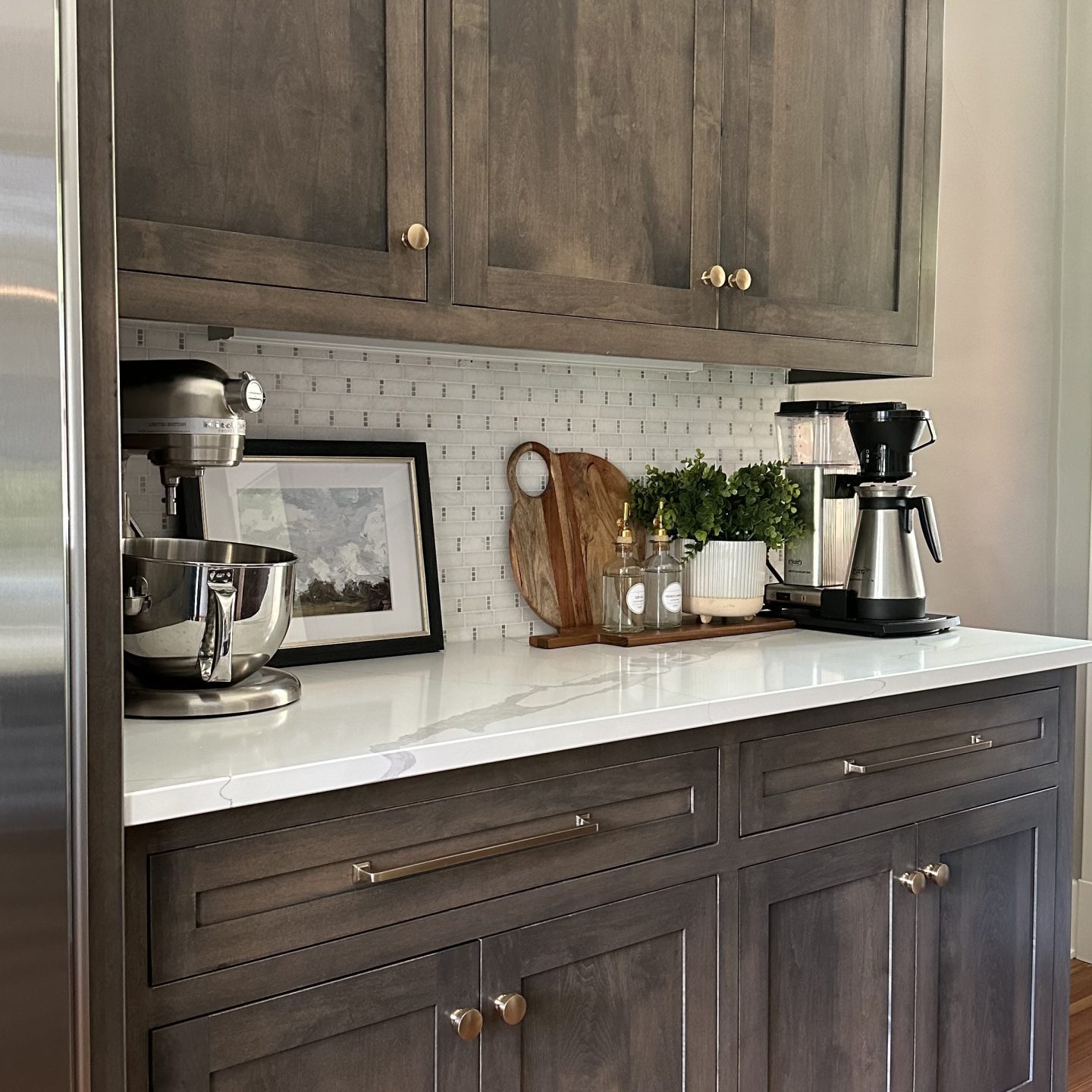 White granite countertops in a German Village home with modern coffee maker and kitchen decor.