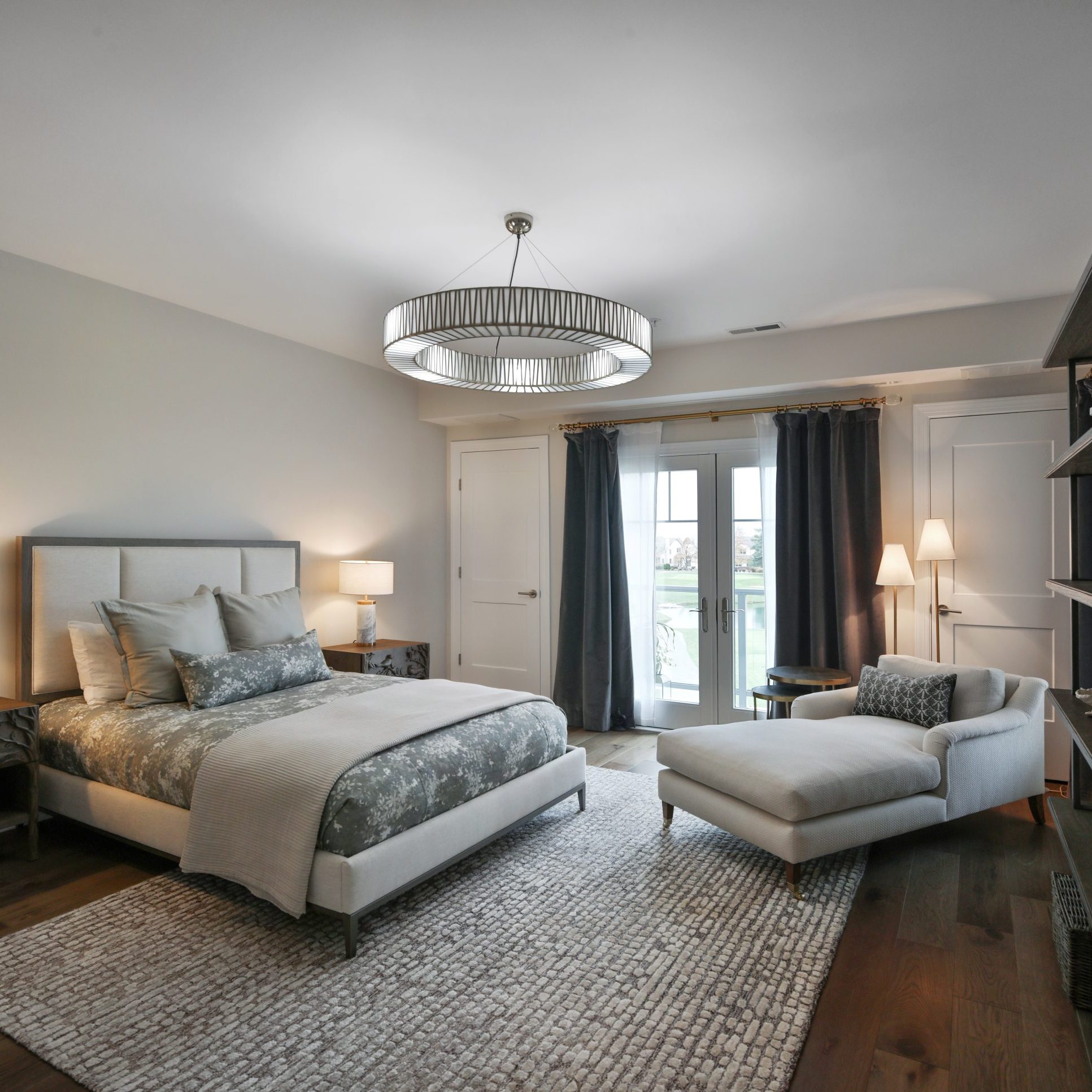 Primary bedroom in condo overlooking a country club gold course.