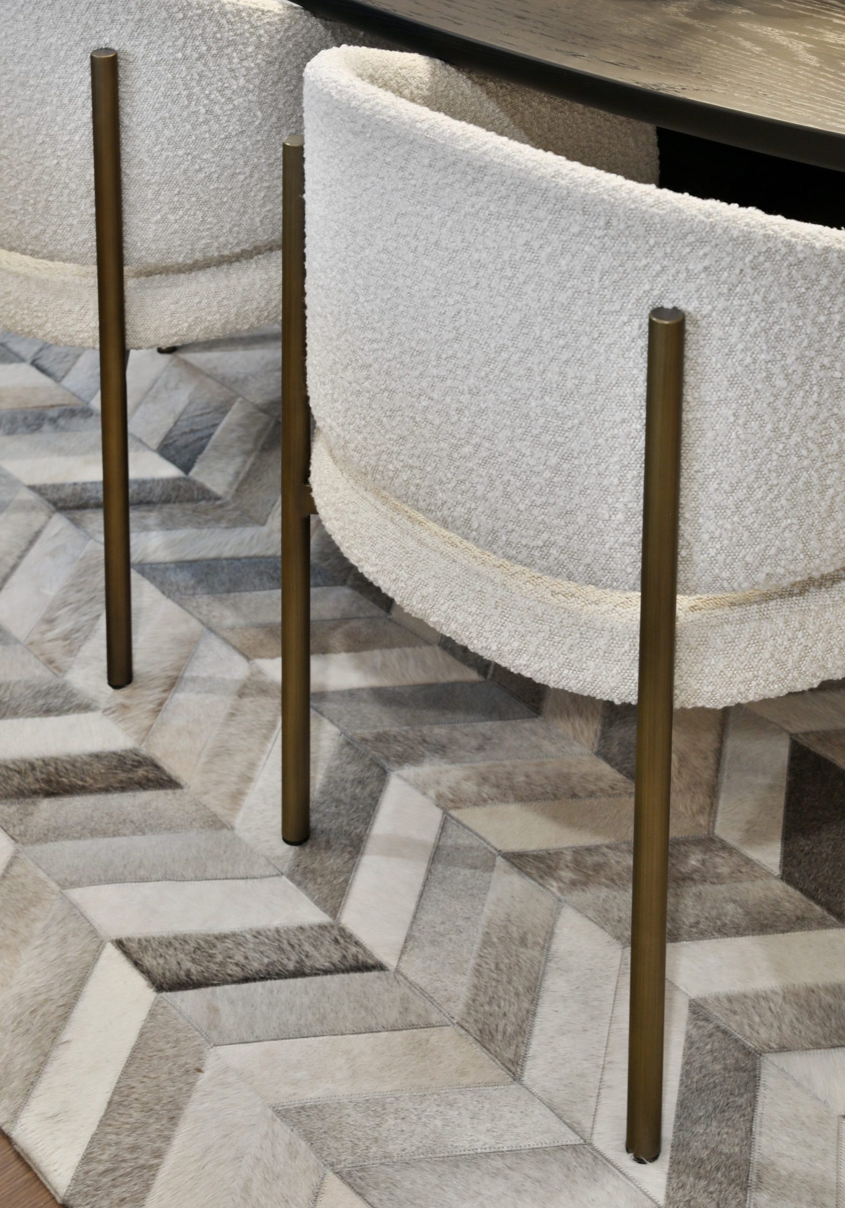 Upholstered boucle dining chairs in a high-end dining space in central Ohio Condo.