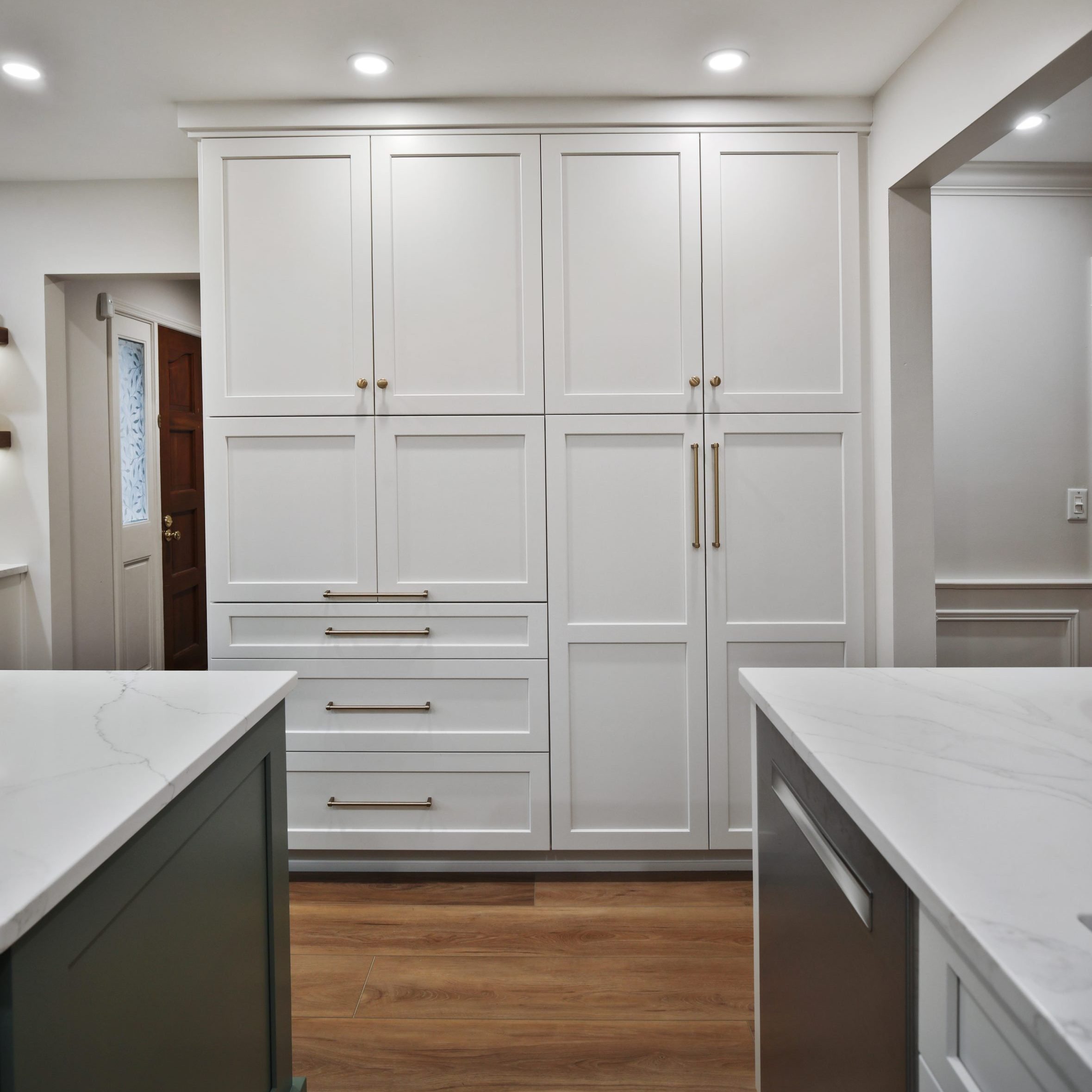 Floor to ceiling custom white cabinets in a remodeled Clintonville home.