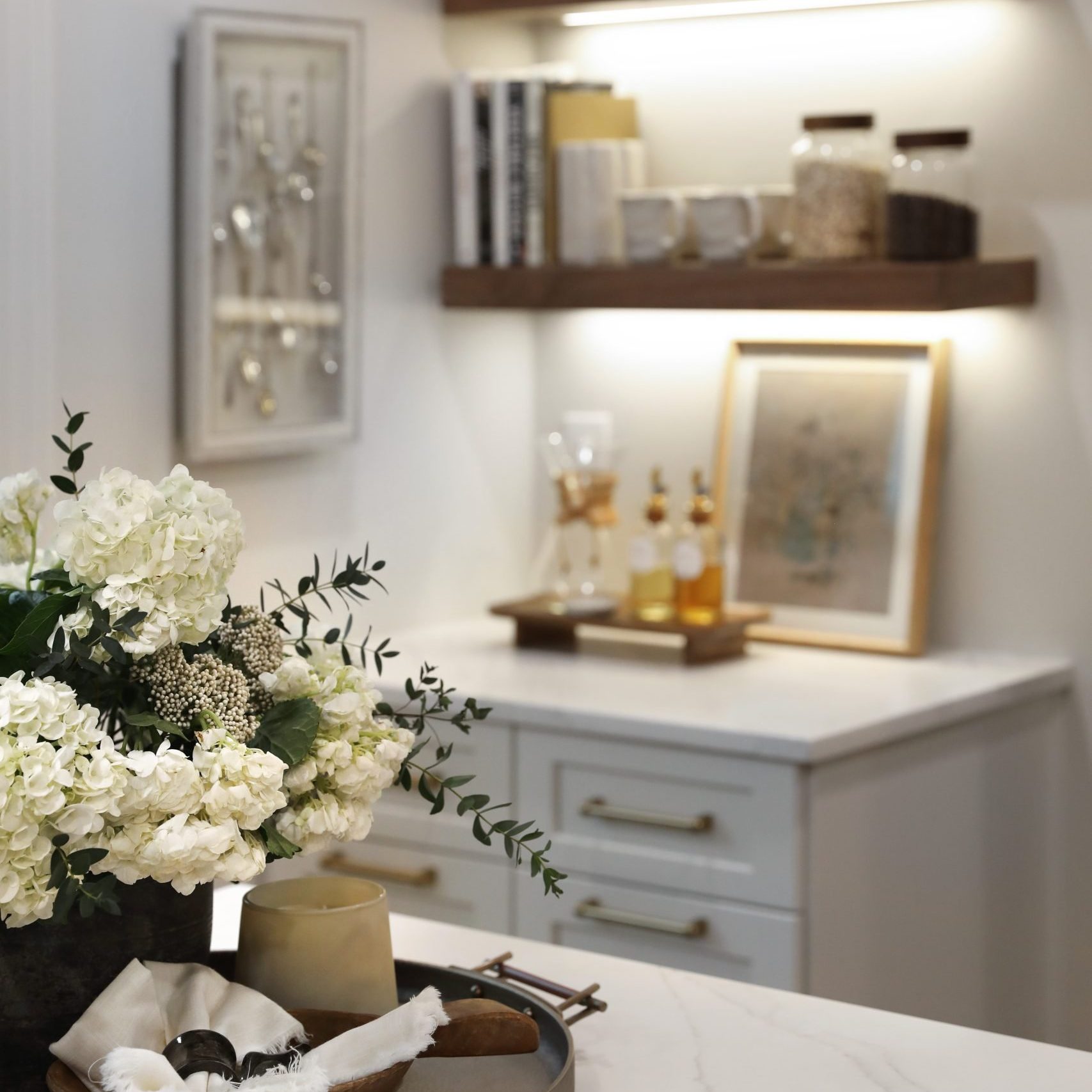 Professionally styled kitchen island and coffee station designed by premiere interior design firm in Pacific Palisades, California, Jennifer Donahue Interior Design Inc